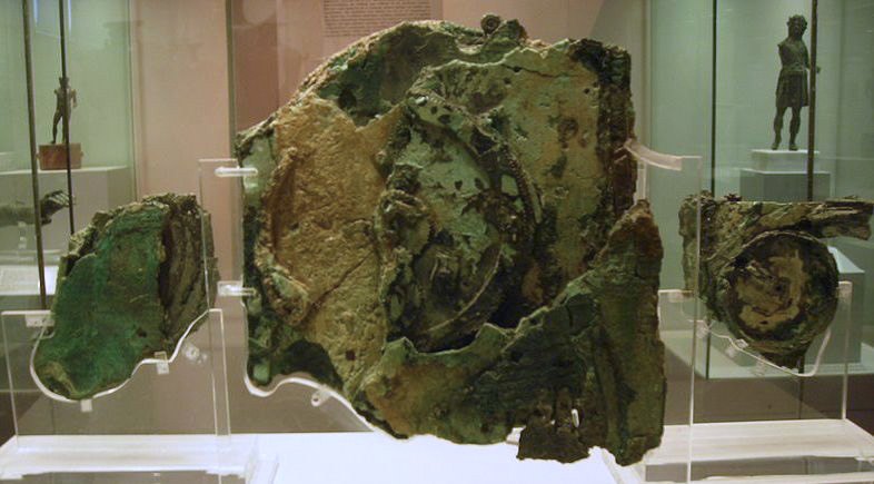 Figure 2 — Three of the major fragments as displayed in Athens: B (left), A (centre) and C (right). Fragment B carries part of the upper back spiral; Fragment C preserves part of the front dial, with the zodi…