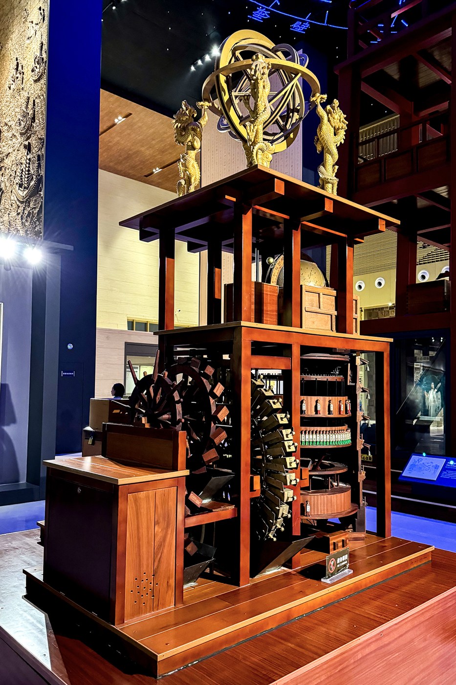 Figure 5 — A model of Su Song's astronomical clock tower of 1088–1094 in the Kaifeng Museum, cut open to show the water wheel and gearing in the lower storeys, the timekeeping figures in the middle and the ar…