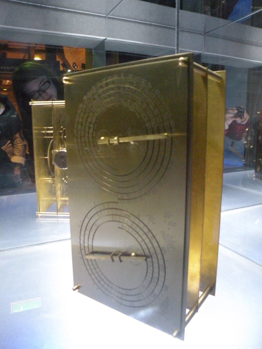 Figure 4 — A brass reconstruction of the mechanism in the Musée des Arts et Métiers, Paris, showing the back face with its two spiral dials and their pointers. The maker is not stated on the image's source page.