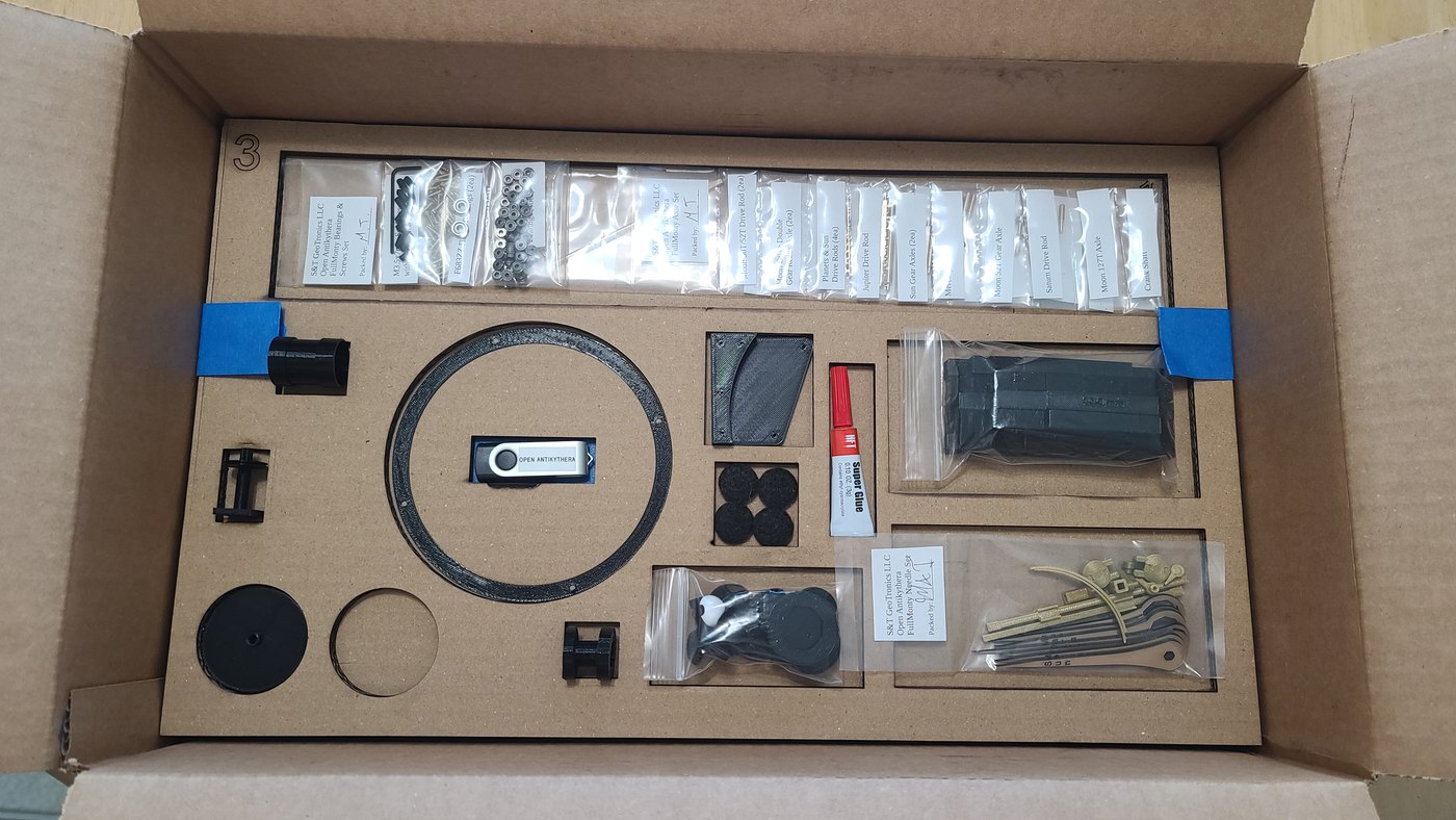 Figure 5 — One of the seven numbered cardboard trays in which a kit ships: the bearings, screws, needles, USB drive and small parts each have a cut-out. The trays were themselves laser-cut on S&T's 60 W laser.