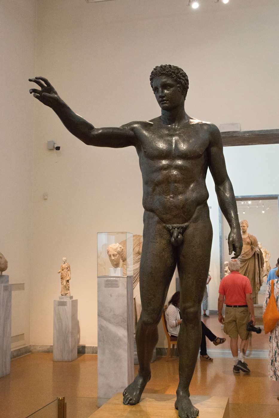 Figure 5 — The Antikythera Youth (Ephebe), a bronze statue of about 340–330 BC, recovered in pieces from the wreck in 1900–1901 and reassembled in Athens. Its identity is unknown — Paris holding the apple, or…