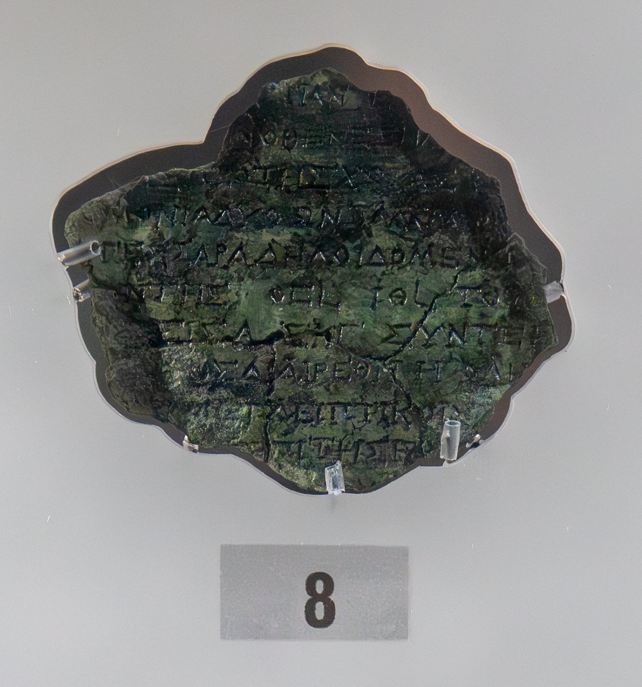 Figure 6 — Fragment 19, part of the back cover inscription. Among its lines are the numbers of three great astronomical cycles: 19 (the Metonic), 76 (the Callippic) and 223 (the Saros). (The large "8" is the …