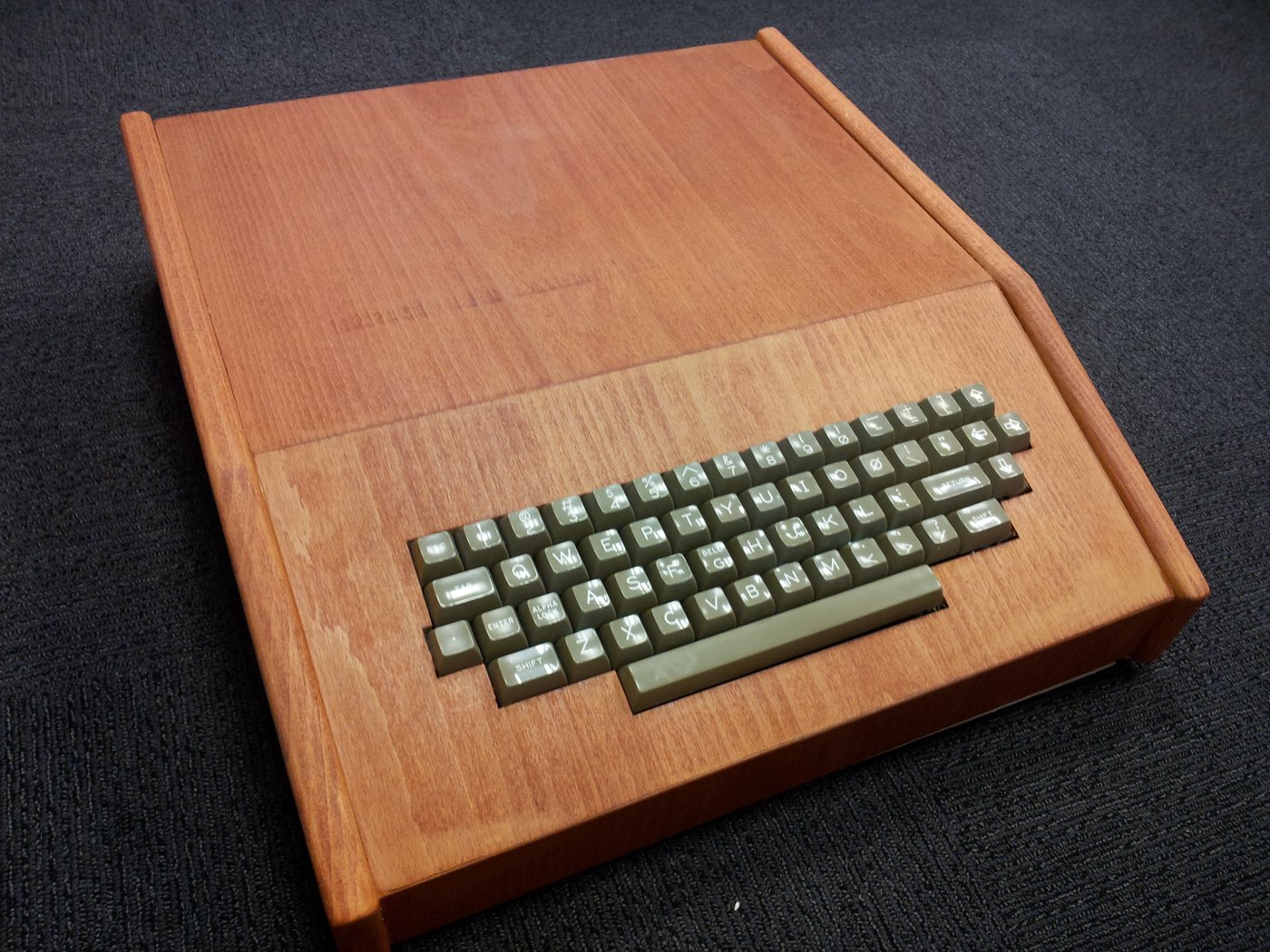Figure 4 — An Apple-1 replica in a wooden case on display at the Israeli PC Museum, Haifa — the form most owners gave their machines in 1976–77. Which replica board is inside is not recorded.