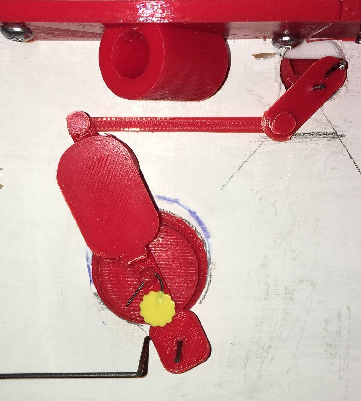 Figure 5 — The release mechanism under the top deck, Gardi's main departure from E.S.R.'s design: the release wheel with its new lever (top), the lever joiner, and the release balance on its holder glued to t…