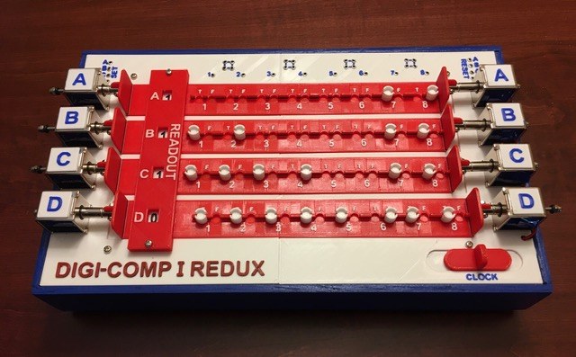 Figure 8 — Michael Gardi's Digi-Comp I Redux (2019): four flip-flop rows, A to D, each with a readout and a row of peg positions, and a clock lever at the right. It runs the programs of the original Digi-Comp…