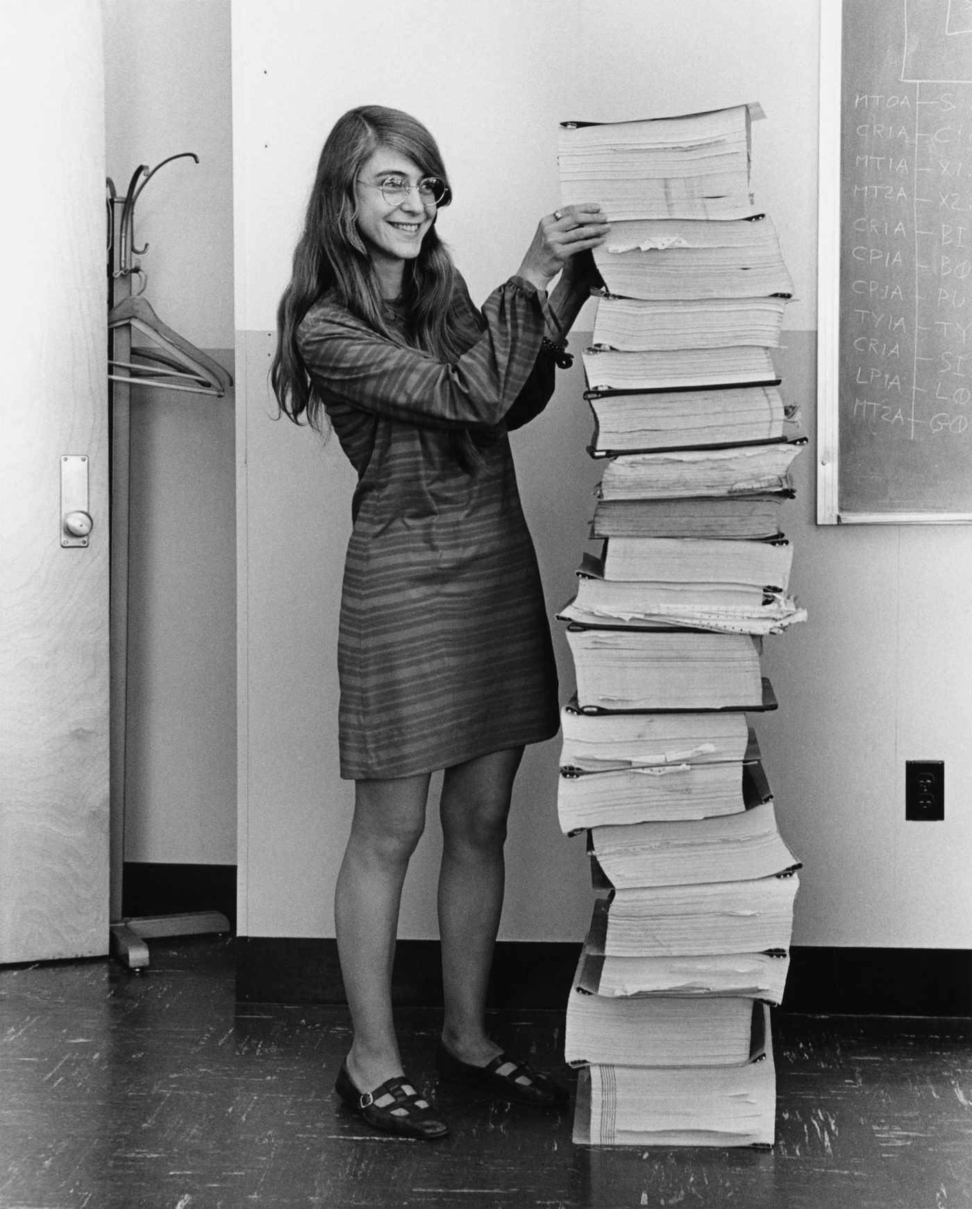 Figure 5 — Margaret Hamilton, director of software engineering for the Apollo flight computer at the MIT Instrumentation Laboratory, beside printouts of the Apollo guidance software. Photo: File:Ma…