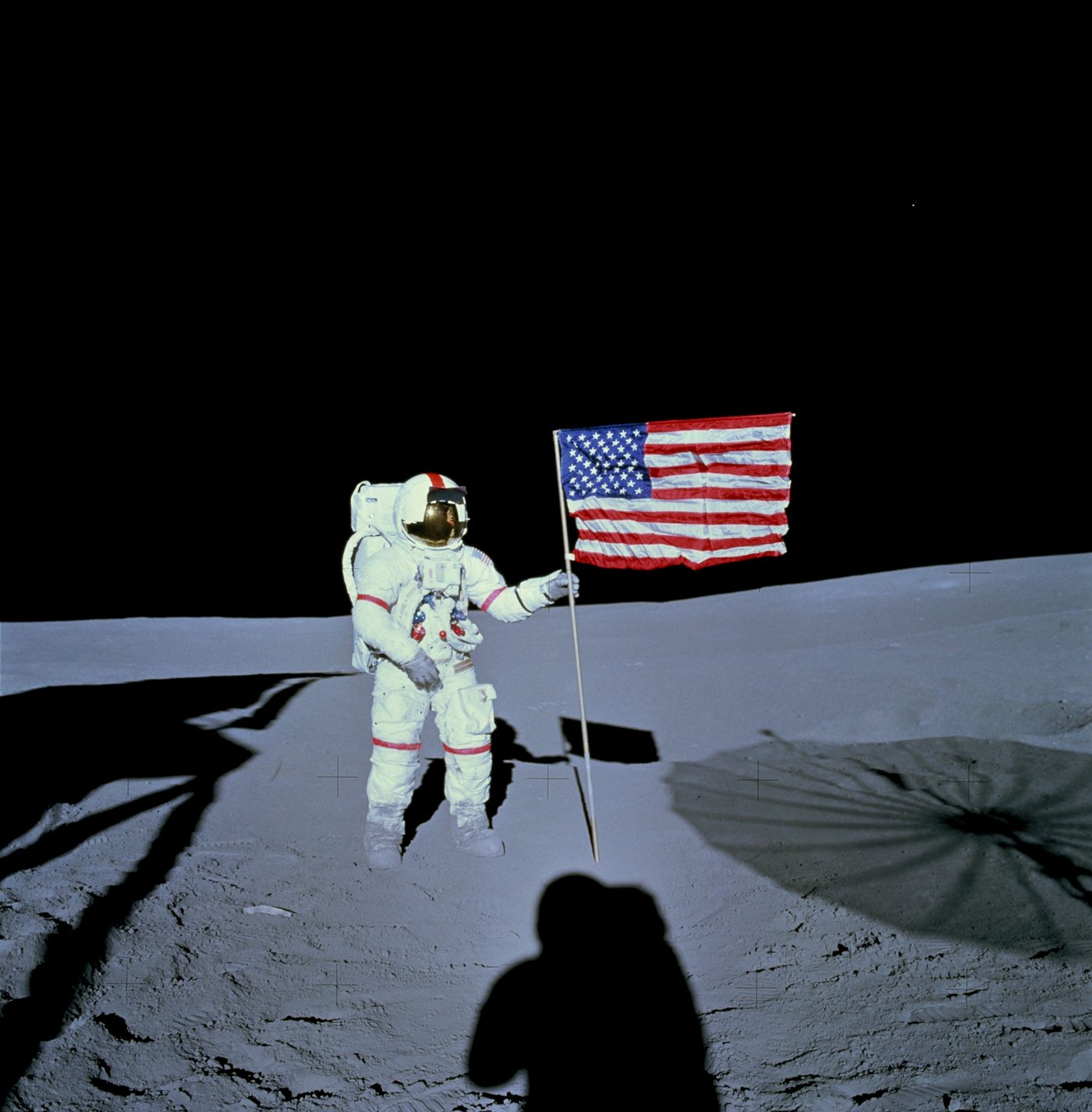 Figure 4 — Alan Shepard, commander of Apollo 14, on the lunar surface at Fra Mauro — a landing that happened only because the crew hand-keyed Don Eyles's abort-switch workaround into the DSKY durin…
