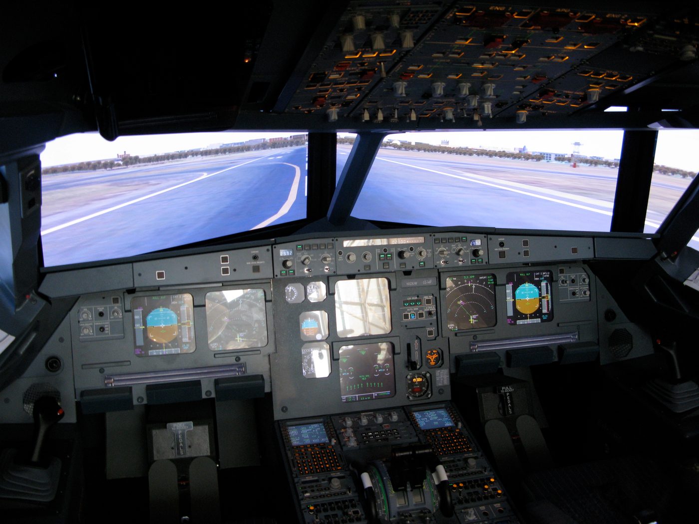 Figure 4 — The glass cockpit of an Airbus A320. Entering service in 1988, the A320 was the first mass-produced airliner with full digital fly-by-wire — the commercial culmination of a path that beg…