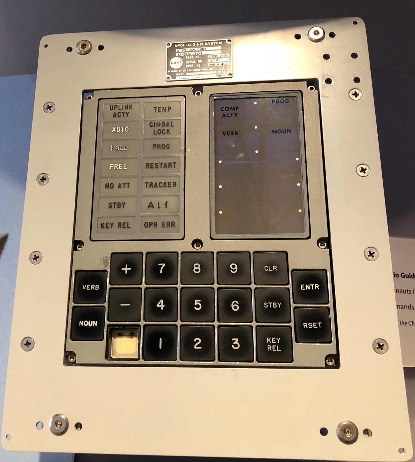 Figure 3 — A flown-type DSKY on display: the verb/noun keyboard and electroluminescent display that were the crew's entire window into the guidance computer. File:Apollo DSKY CHM.agr.jpg by ArnoldR…