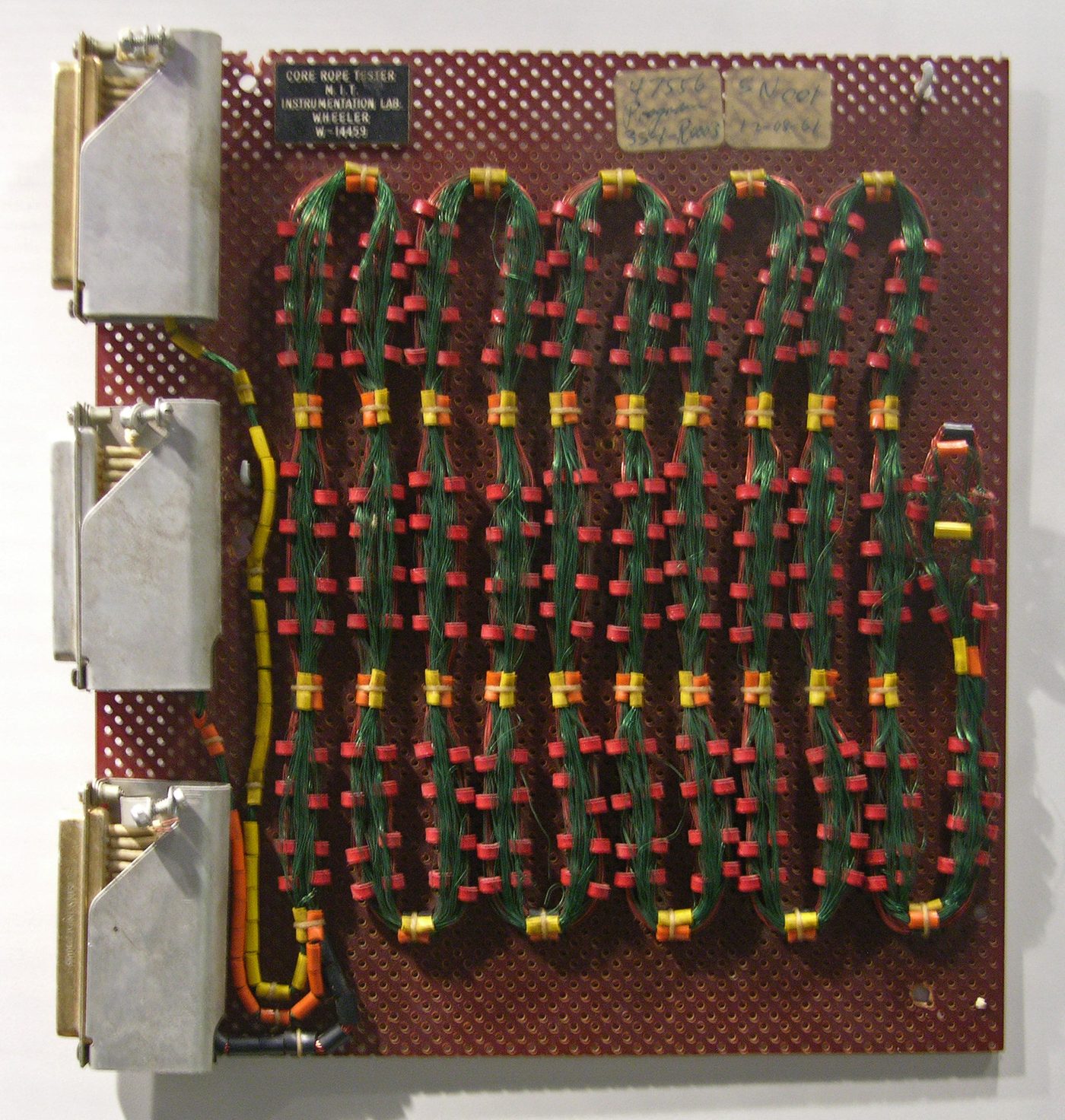Figure 2 — Apollo-era core memory: program bits were defined physically by whether a wire passed through or around each tiny ferrite ring, making the AGC's memory literally hand-woven. File:Apollo …
