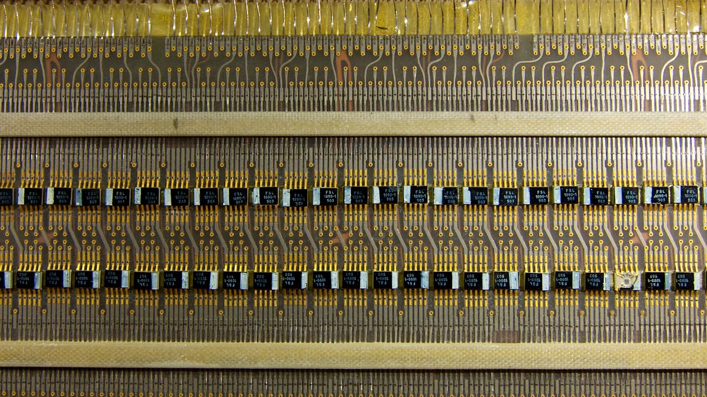 Figure 2 — A single AGC logic module, one of dozens of flat trays that slotted into the computer. The Block II machine was built almost entirely from one repeated part: a dual three-input NOR gate.…