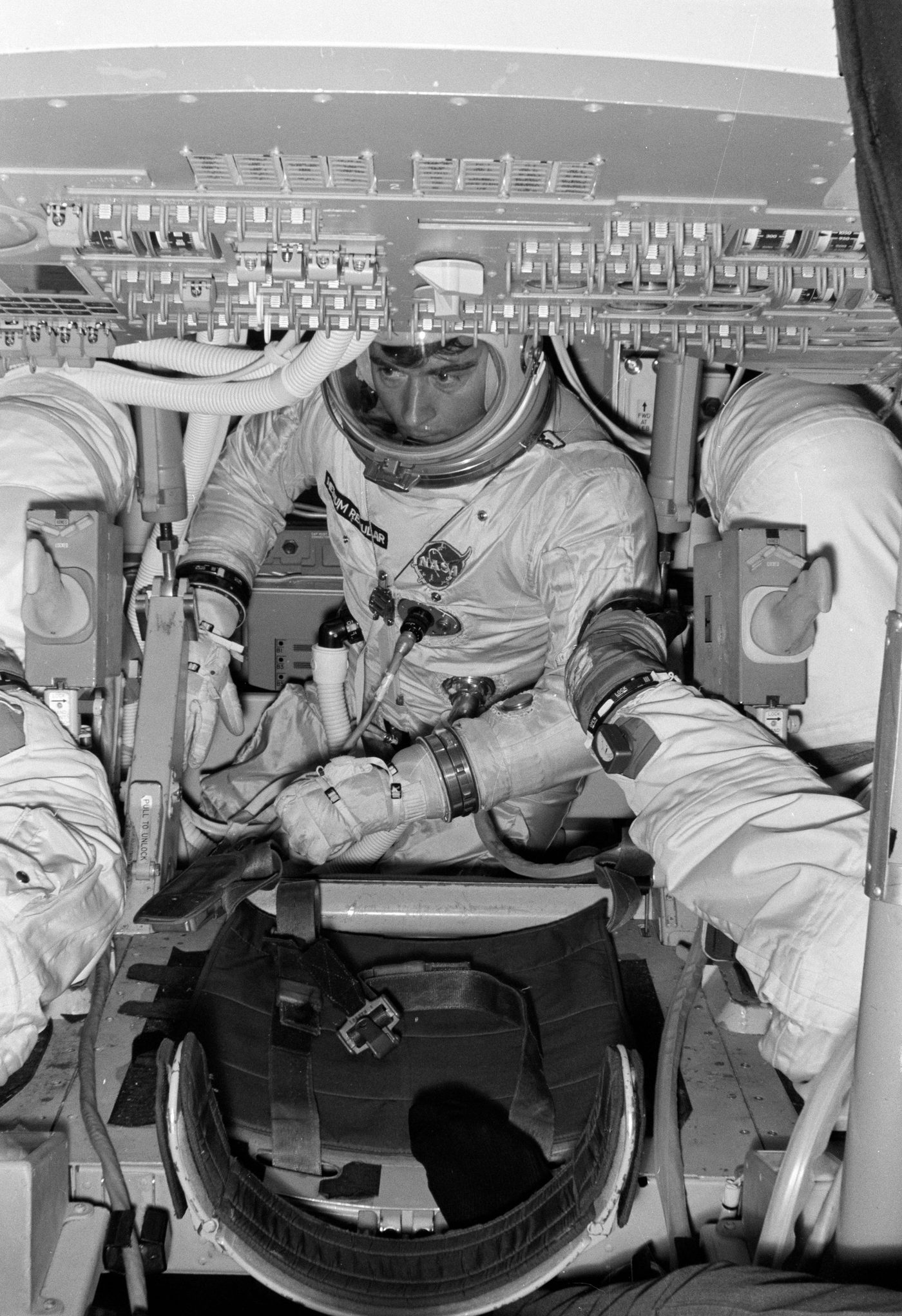 Figure 4 — Astronaut John Young at the DSKY in a Command Module simulator. Crews logged hundreds of hours keying verbs and nouns until the ritual became reflex. Photo: File:Astronaut John Young in …