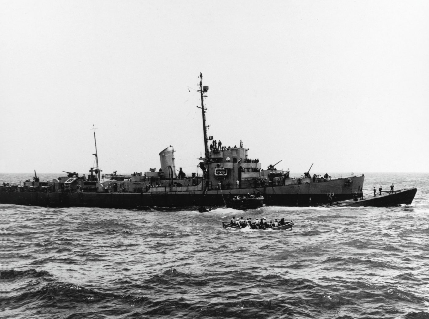 Figure 5 — The captured U-505 under tow alongside USS Pillsbury, 4 June 1944; a later capture (its own Enigma and codebooks taken) that echoed the desperate pinches of 1941–42. Photo: File:USS Pill…