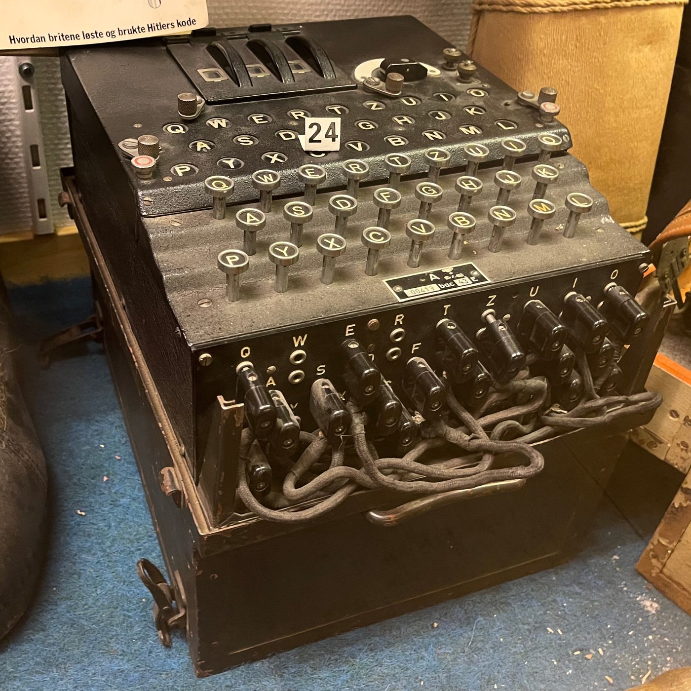 Figure 3 — A genuine three-rotor military Enigma. On the original, the cipher is embodied in physically spinning wired rotors and a mechanical pawl-and-ratchet stepping; the Open Enigma reproduces …