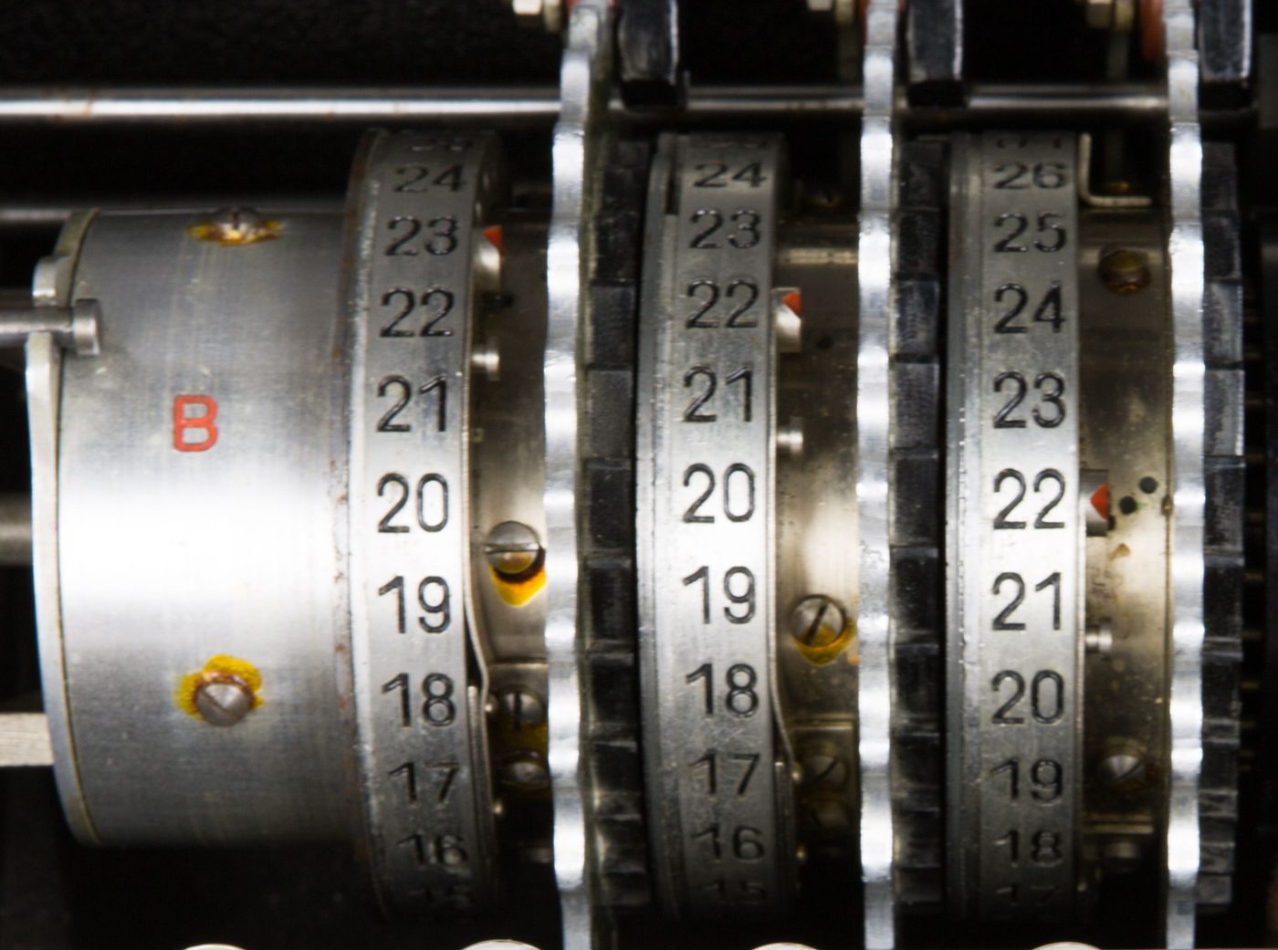 Figure 2 — The wheel set of an Enigma I: three rotating rotors mounted to the right of the reflector (far left). Current enters from the right, runs left to the reflector, and returns. File:Enigma …