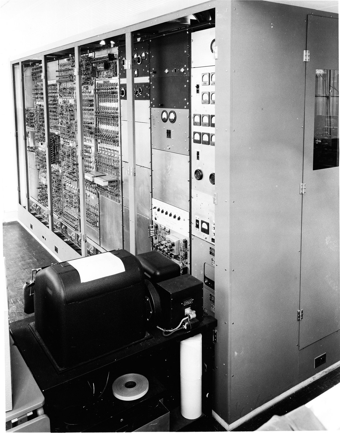 Figure 2 — SEAC at the National Bureau of Standards, Washington, D.C., with its teletype for input and output in front of the equipment racks. Blankenbaker was one of four student interns assigned to it in th…