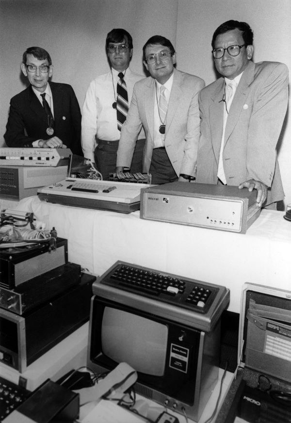 Figure 1 — Winners of The Computer Museum's Early Model Personal Computer Contest at the prize-giving in Boston, 1986, wearing their engraved silicon-wafer medals. From left: John V. Blankenbaker (KENBAK-1), …