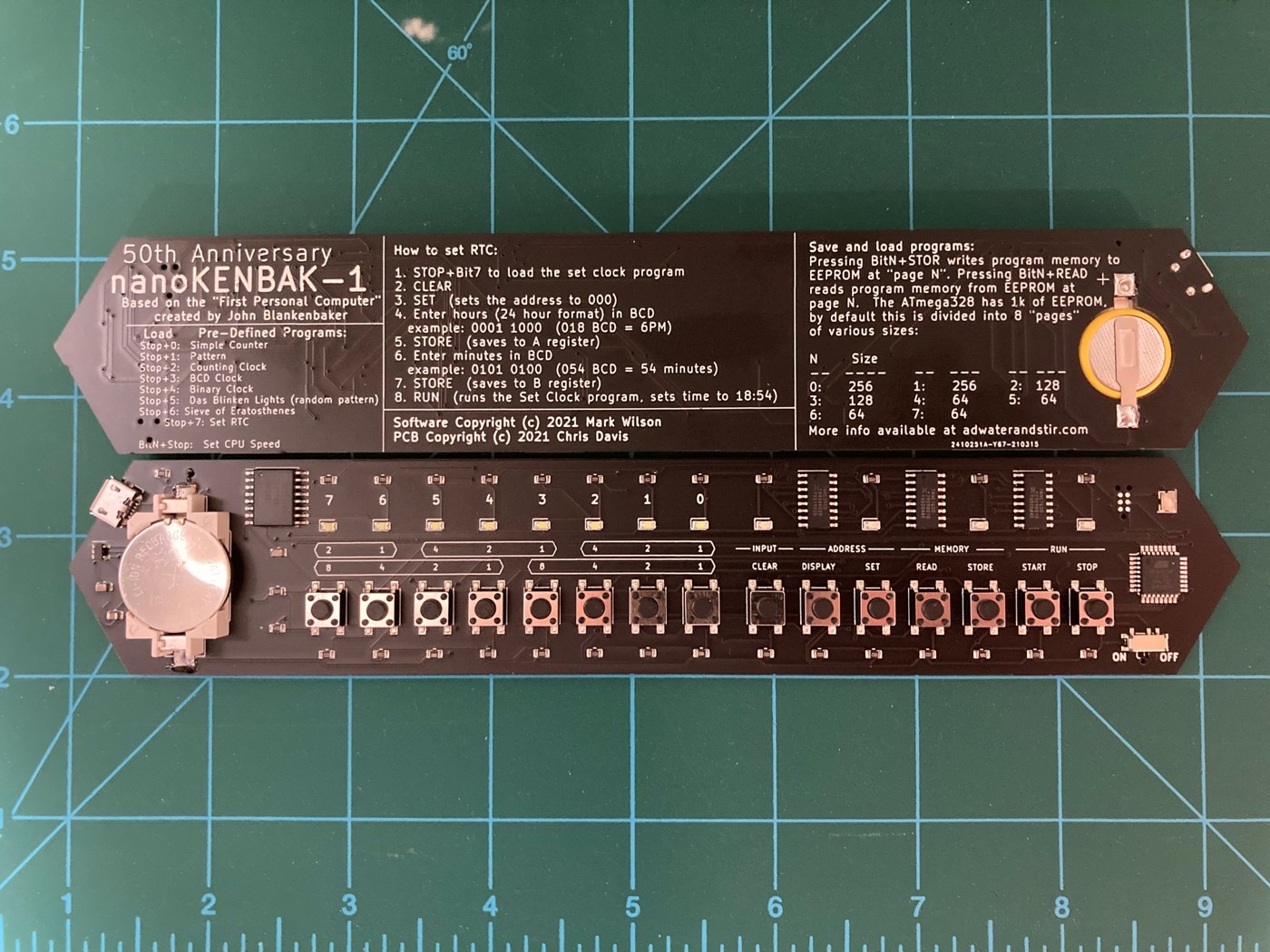 Figure 8 — The nanoKENBAK-1, made for the KENBAK-1's fiftieth anniversary in 2021: the whole front panel on one surface-mount board, with an instruction summary printed on the silkscreen, a coin-cell holder a…