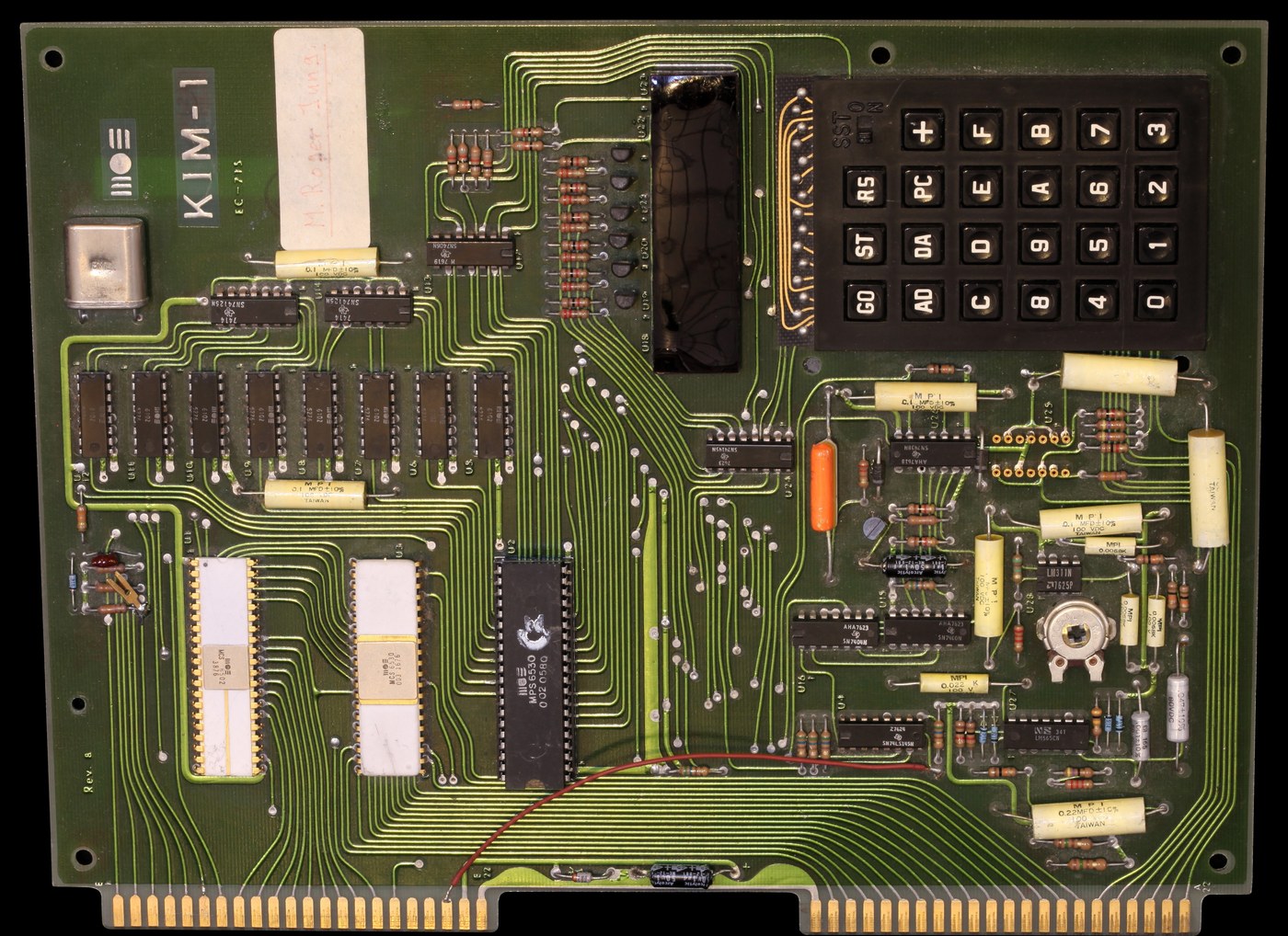 Figure 1 — An early MOS Technology KIM-1 (revision A) photographed from directly above, turned so that the two gold-fingered edge connectors run along the bottom. The three 40-pin chips are the 6502 processor…