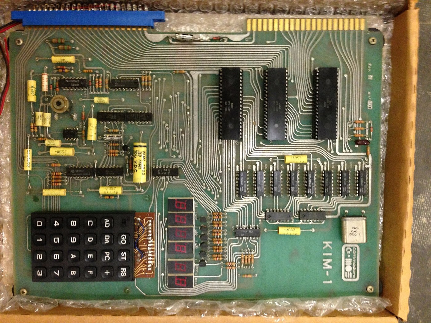 Figure 3 — A Commodore KIM-1 in its packing tray. The board is the same 6502, two 6530s and kilobyte of RAM as MOS's original, now with the Commodore logo beside the KIM-1 name.