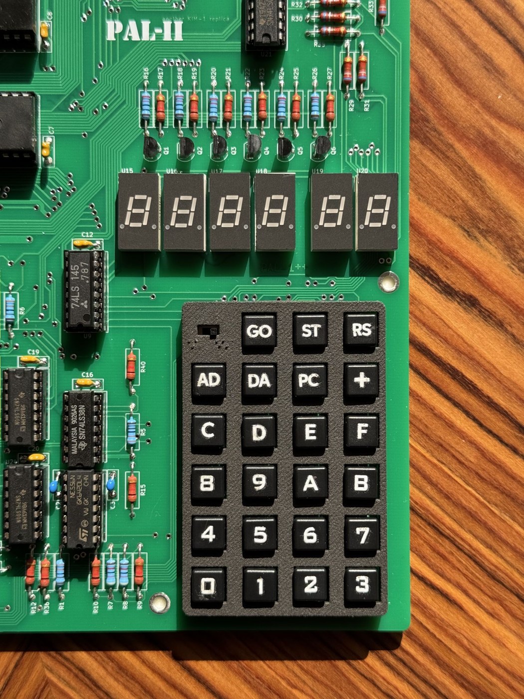 Figure 4 — The PAL-2's display and keypad. The keys follow the later Commodore KIM-1 arrangement — GO, ST and RS across the top, then AD, DA, PC and +, then the hex keys from C D E F down to 0 1 2 3 — under a…