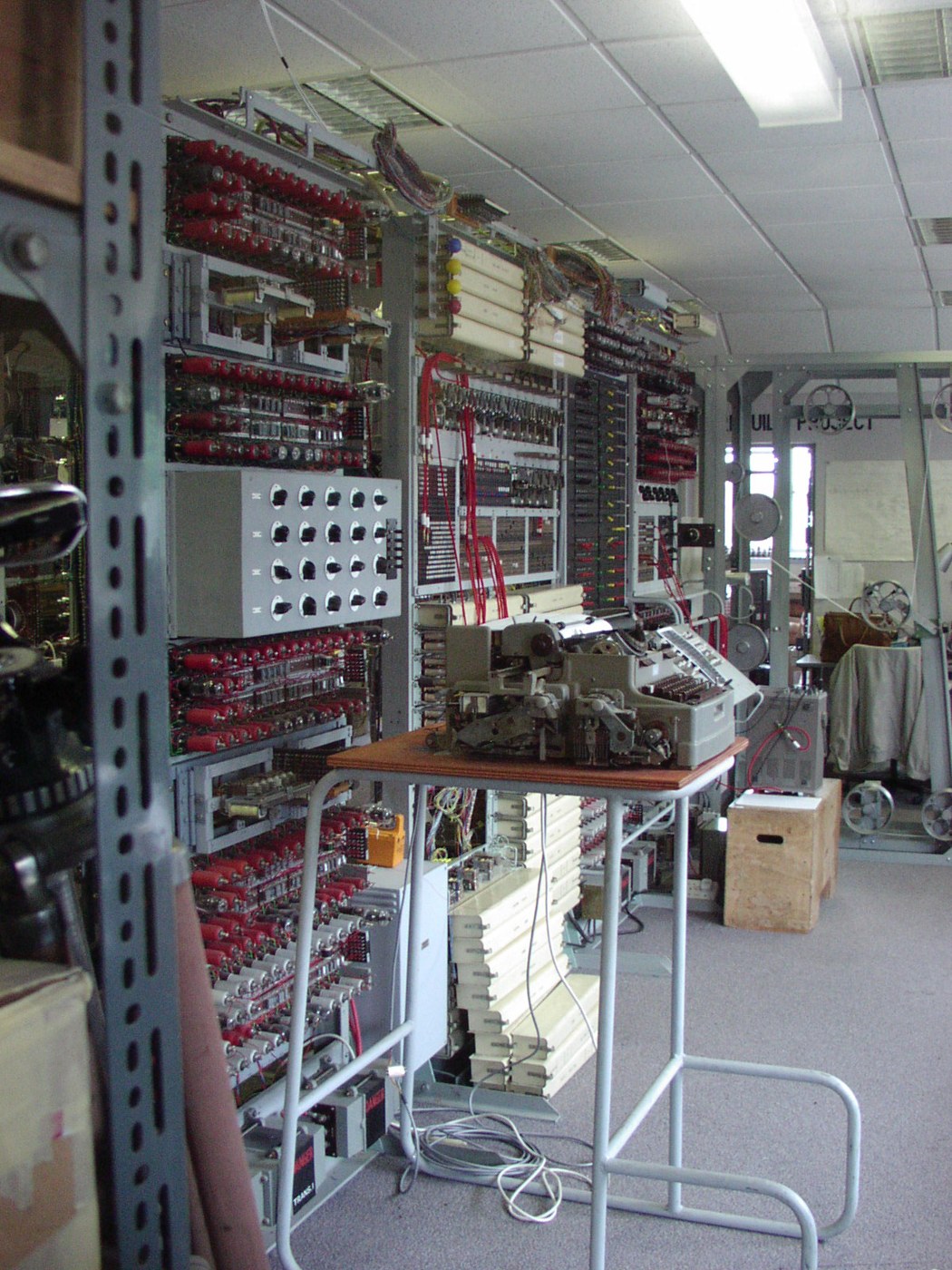 Figure 1 — The Colossus rebuild at Bletchley Park in January 2005, part-way through Tony Sale's fourteen-year project. On the left, the racks of valve logic and the switch panels; in the middle distance the t…