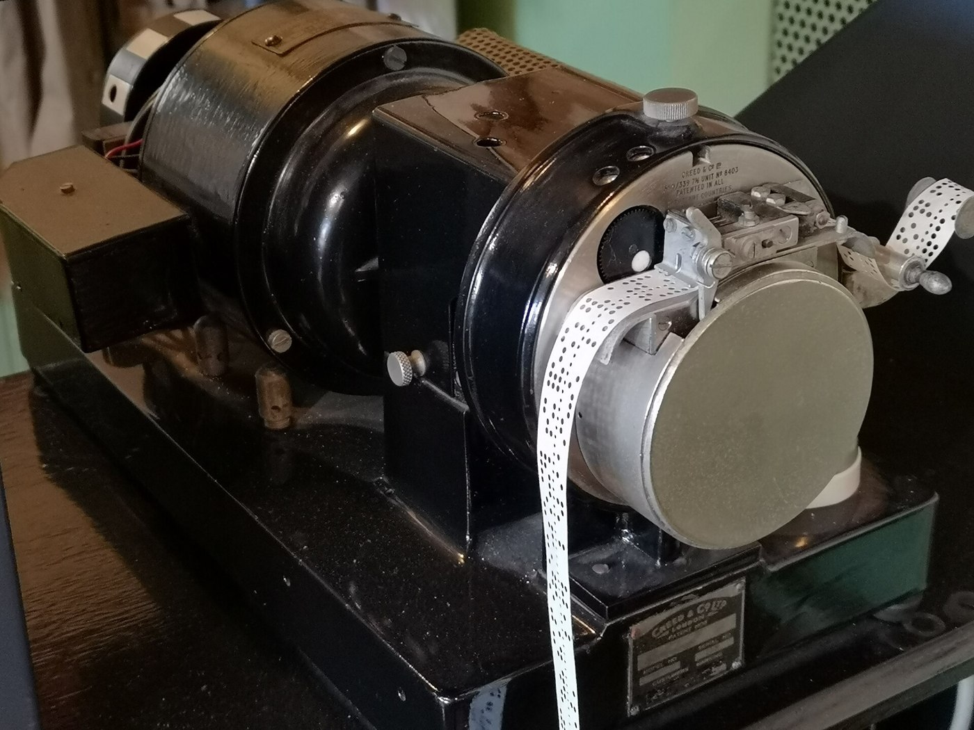 Figure 5 — A Creed model 6S/2 five-hole paper tape reader at The National Museum of Computing. Mechanical readers like this one sense the holes with pins and send each character down a current loop; one can f…