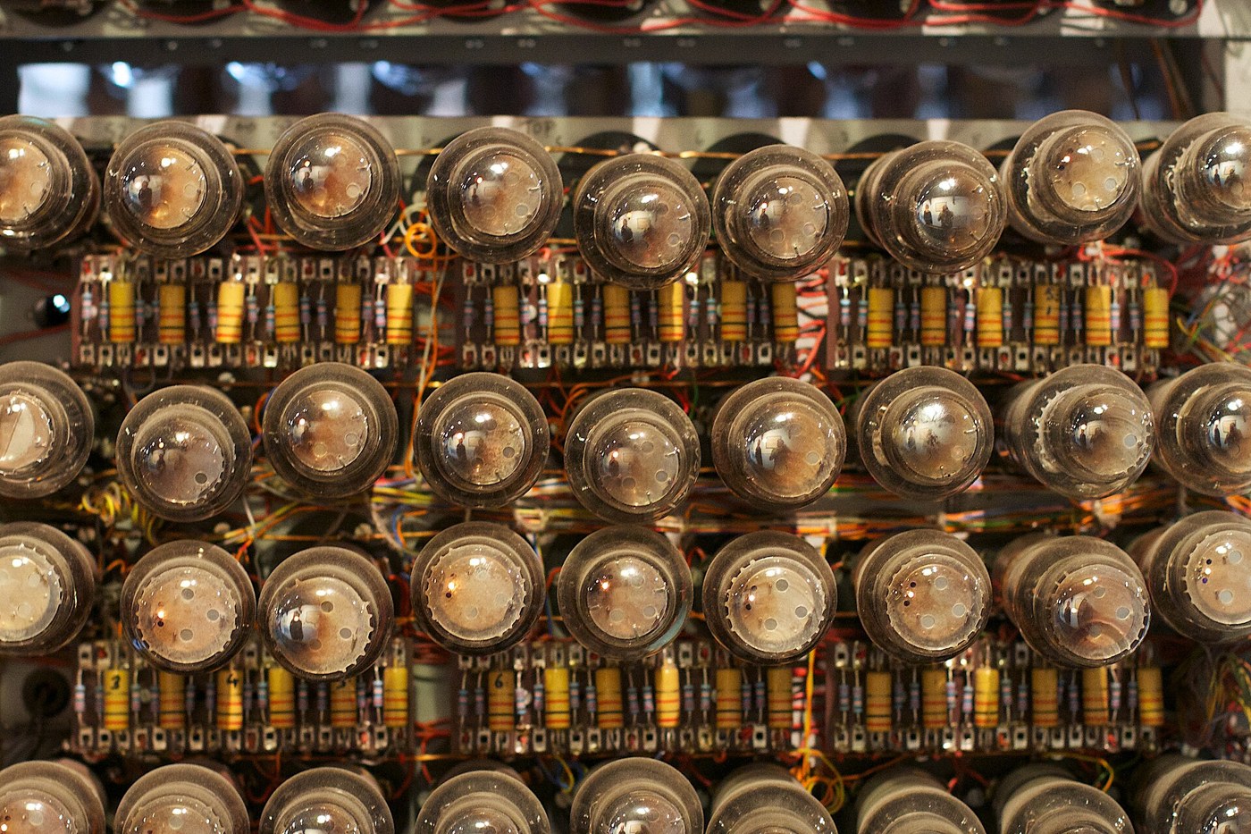 Figure 4 — Part of the rebuilt Colossus at The National Museum of Computing: a panel of valves, with their resistors and capacitors wired point to point on the chassis behind. The first Colossus had about 1,6…
