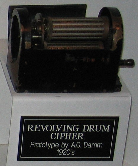 Figure 5 — A "revolving drum cipher" prototype by Arvid G. Damm, 1920s, on display with its museum label. Damm's machines were full of ideas — alphabet drums, rotors, link chains — but almost none reached pro…