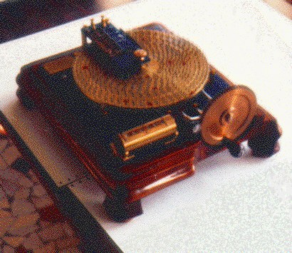 Figure 5 — The Carissan machine with its detecting armature restored above the rings. The arm carries a contact for each ring along the "line of investigation"; the contacts are in series, so the circuit comp…