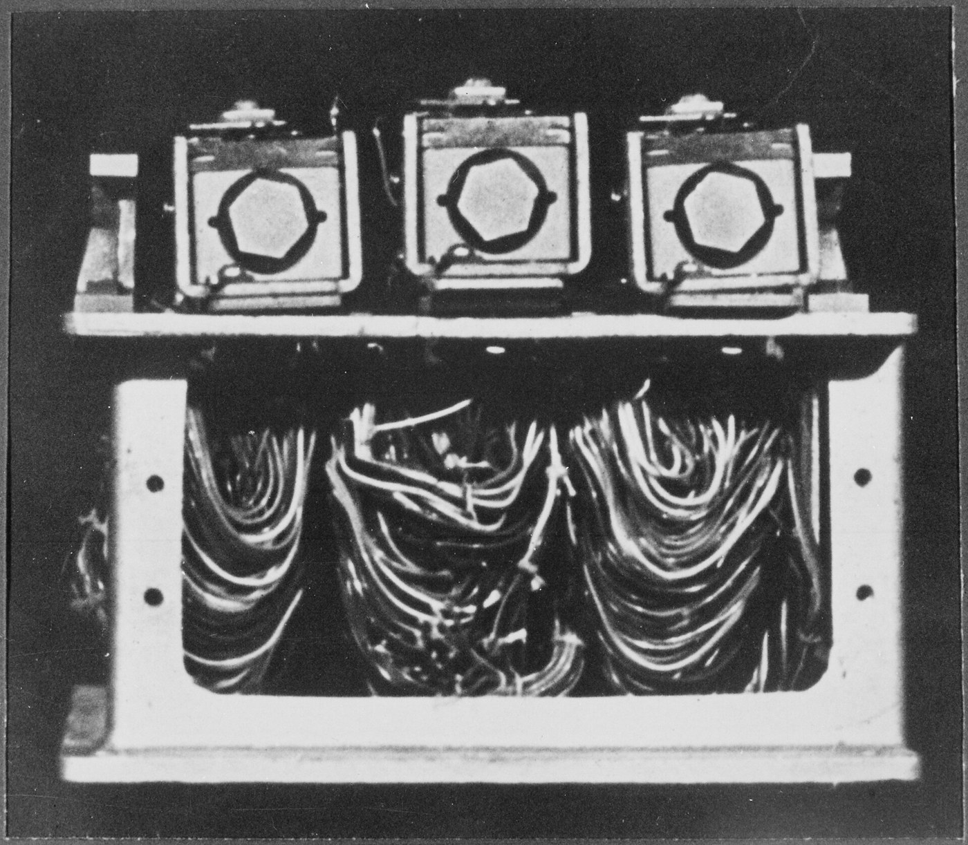 Figure 1 — A wartime US photograph in the National Archives, catalogued as "Machine for deciphering Japanese 'Purple' diplomatic code" (War and Conflict No. 833): three stepping-switch assemblies above a bank…