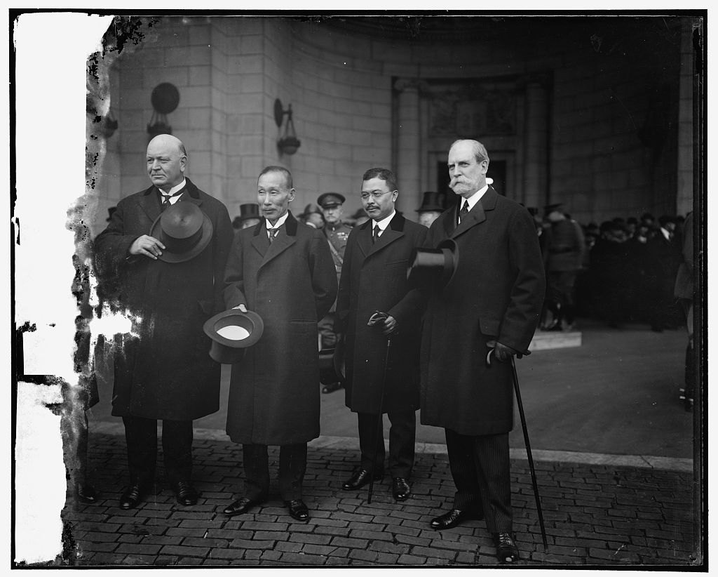 Figure 4 — Delegates at the arms conference, 1921. The Library of Congress title identifies the men, left to right, as U.S. Secretary of the Navy Edwin Denby, Admiral Katō Tomosaburō, Prince Tokugawa Iesato a…