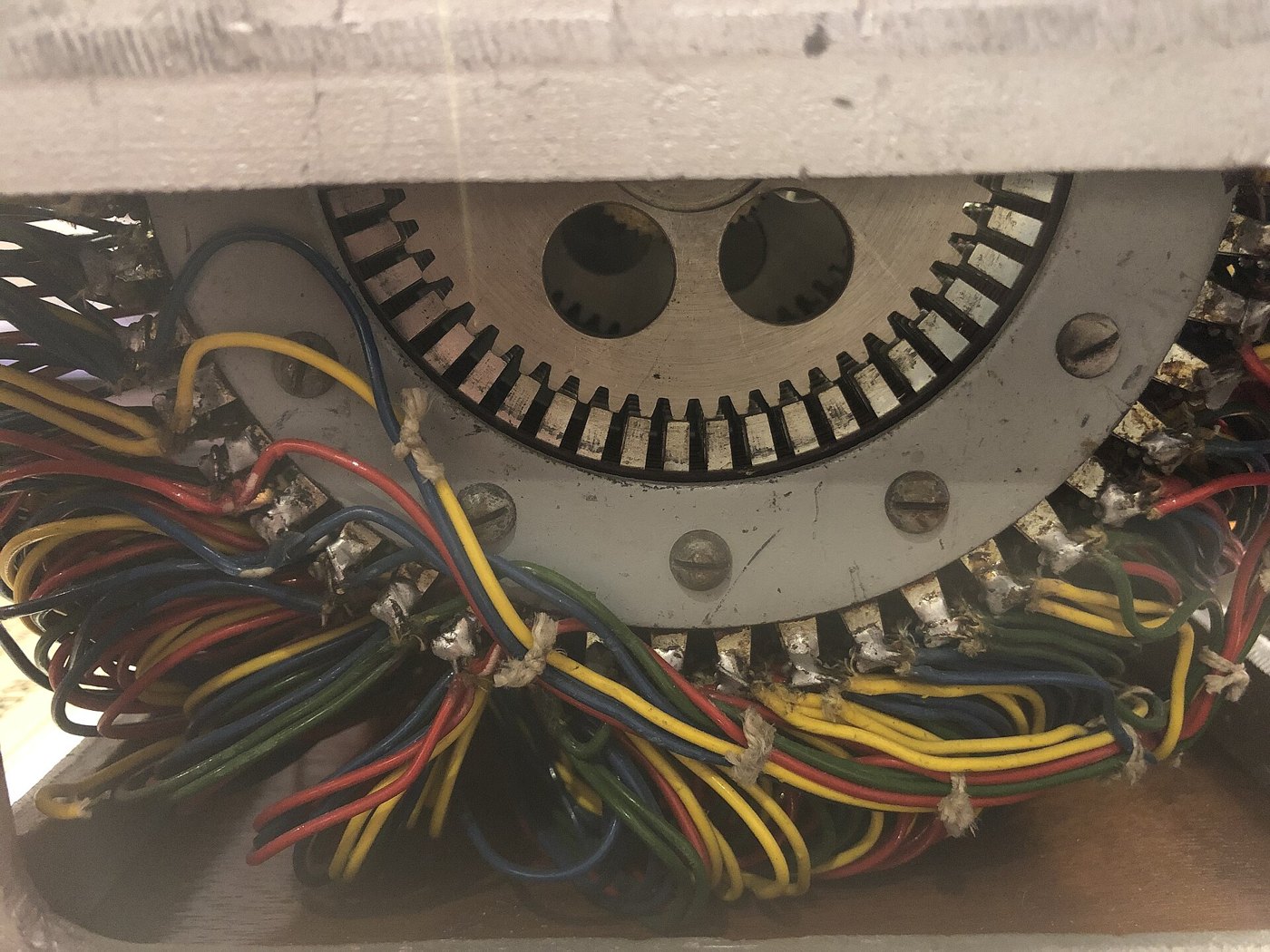 Figure 1 — The underside of a real PURPLE stepping switch in the Berlin fragment: the arc of contact terminals with its colour-coded wiring. Every one of these cross-connections had to be deduced, without sig…