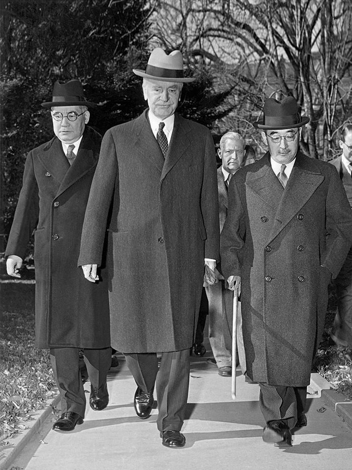 Figure 1 — Secretary of State Cordell Hull (centre) walks Ambassador Kichisaburō Nomura (left) and Special Envoy Saburō Kurusu (right) to the White House on 17 November 1941. For the next three weeks every in…