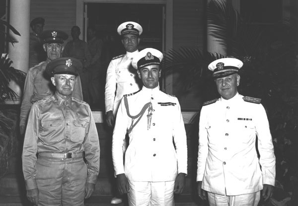 Figure 6 — Lieutenant General Walter C. Short (left) and Admiral Husband E. Kimmel (right) with Lord Louis Mountbatten (centre) in Hawaii, August 1941; behind them are Major General Frederick L. Martin and Re…
